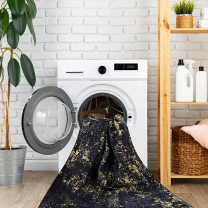 Maval - 6' X 9' Washable Area Rug - Black / Gold - Ego Home Furniture